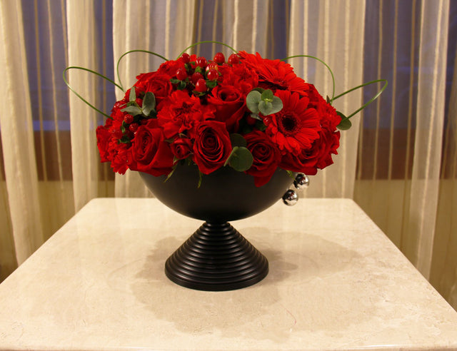 Assortment of red Roses in black vase