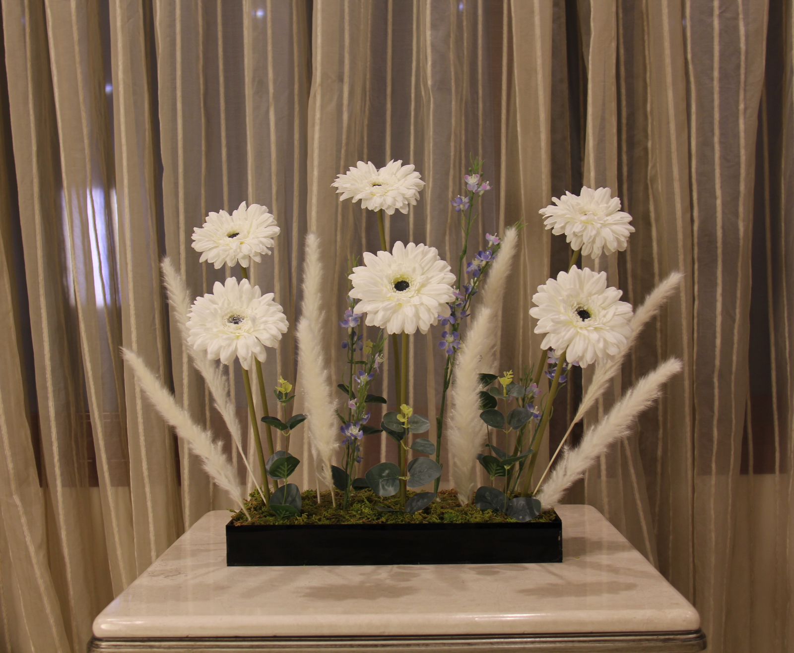 Artificial Gerbera flowers in glossy black acrylic box