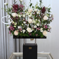 Wooden stand with a mix of natural flowers
