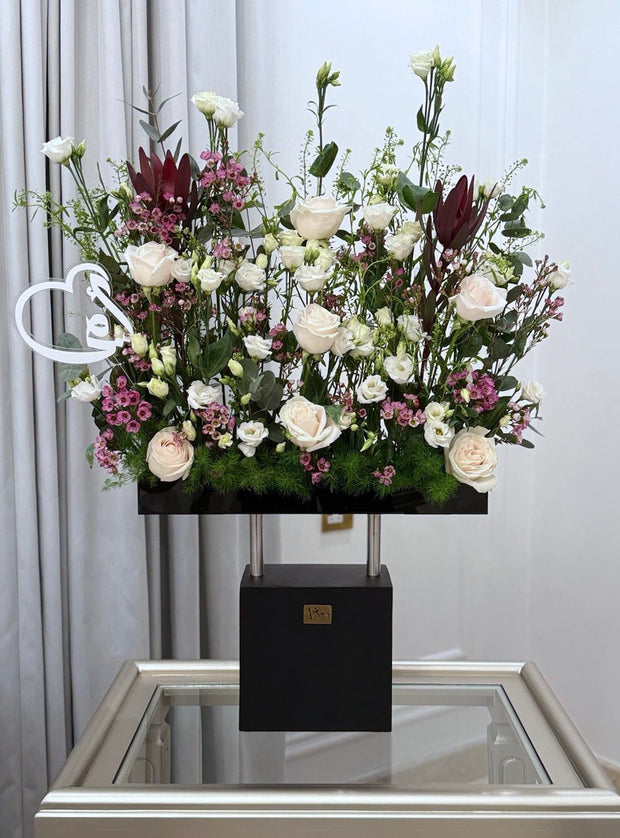 Wooden stand with a mix of natural flowers